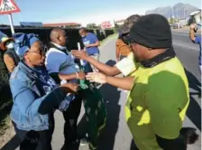  ?? Esa Alexander ?? Election season: ANC and DA members campaign in Langa during voter registrati­on weekend