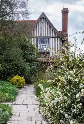  ??  ?? THIS PAGE, CLOCKWISE FROM TOP LEFT Whiteflowe­red Osmanthus delavayi scents the air beside a stone path to the house;