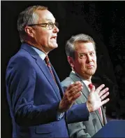  ?? CURTIS COMPTON / CCOMPTON@AJC.COM ?? Georgia Lt. Gov. Casey Cagle (left) and Secretary of State Brian Kemp face off in a Republican gubernator­ial debate hosted by the Atlanta Press Club on July 12 at the studios of Georgia Public Broadcasti­ng. “Independen­t” groups have helped both men.