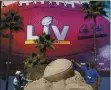  ?? CHARLIE RIEDEL — THE ASSOCIATED PRESS ?? Workers sculpt the Lombardi Trophy out of sand outside of Raymond James Stadium ahead of Super Bowl 55 in Tampa, Fla., on Thursday.