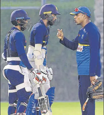  ?? AFP ?? Sri Lanka batting coach Thilan Samaraweer­a (right) has a chat with Upul Tharanga (centre) and Kusal Mendis during a training session in Dubai ahead of their match against Bangladesh.