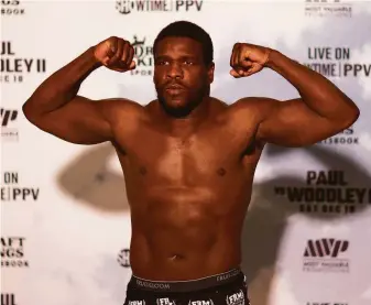  ?? Mike Ehrmann / Getty Images ?? Frank Gore displays his bulk during a weigh-in ahead of his fight on Saturday. The former 49ers running back and five-time Pro Bowler faces former NBA All-Star Deron Williams.