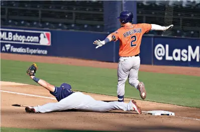  ?? AP Photo/Gregory Bull ?? ■ Tampa Bay Rays first baseman Ji-Man Choi holds up the ball for an out at first on Houston Astros’ Alex Bregman during the seventh inning of Game 2 of an American League Championsh­ip Series on Monday in San Diego.
