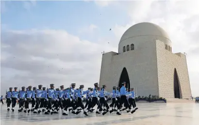  ?? Reuters ?? The Pakistan Air Force personnel march past the mausoleum of Quaid-e-Azam Mohammed Ali Jinnah during Defence Day ceremonies in Karachi on Thursday. —