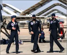  ?? PHOTO VINCENT OSUNA ?? U.S. Air Force Thunderbir­ds pilots take their first steps on the tarmac on Wednesday at Naval Air Facility El Centro.