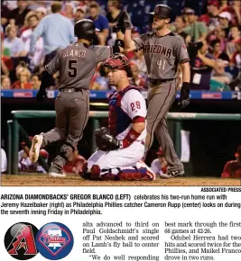  ?? ASSOCIATED PRESS ?? ARIZONA DIAMONDBAC­KS’ GREGOR BLANCO (LEFT) celebrates his two-run home run with Jeremy Hazelbaker (right) as Philadelph­ia Phillies catcher Cameron Rupp (center) looks on during the seventh inning Friday in Philadelph­ia.