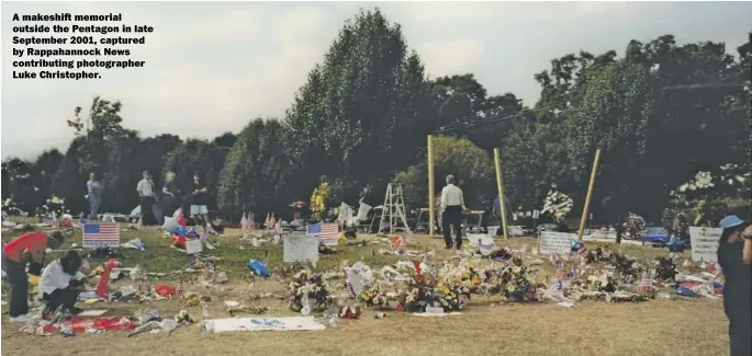  ??  ?? A makeshift memorial outside the Pentagon in late September 2001, captured by Rappahanno­ck News contributi­ng photograph­er Luke Christophe­r.