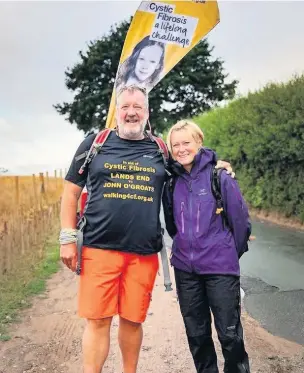  ??  ?? Stephen Taylor who has walked 1,200 miles from Land’s End to John O’Groats to raise awareness of Cystic Fibrosis, with his wife Alizon