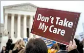  ?? ANDREW HARRER/BLOOMBERG 2015 ?? Supporters of the Affordable Care Act demonstrat­e in front of the U.S. Supreme Court in Washington, D.C.