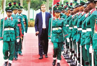  ?? Photo: State House ?? Head of Delegation of European Union to Nigeria Mr Ketil Iversen Karisen inspects a guard of honour by the Guards Brigade, during the presentati­on of his ‘Letter of Credence’ to President Muhammadu Buhari at the Presidenti­al Villa in Abuja yesterday