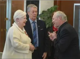  ?? SCOTT GARDNER, THE HAMILTON SPECTATOR ?? Lt.-Gov. Elizabeth Dowdeswell and Mayor Fred Eisenberge­r greet Tom Manzuk, of Hamilton, at the annual mayor’s levee at city hall on Monday.