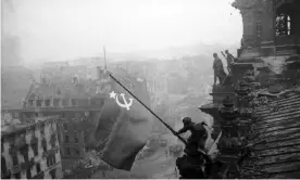  ?? Photograph: SVF2/UIG via Getty ?? Red army soldiers raising the Soviet flag over the Reichstag in Berlin on 30 April 1945. Stalin was determined he, not the US, would be first to enter Berlin and topple Adolf Hitler.