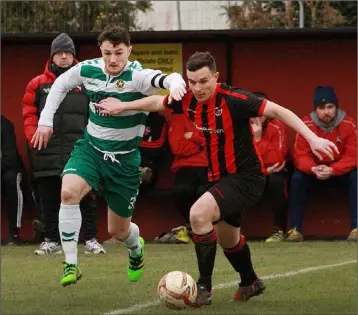  ??  ?? Gavin O’Brien of Gorey Rangers is chased by Paul Murphy of Sheriff Y.C.