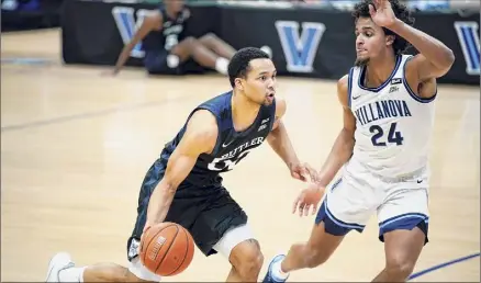  ?? Matt Slocum / Associated Press ?? Butler's Jair Bolden, left, and Villanova's Jeremiah Robinson-earl both had 18 points Wednesday in their battle.