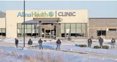  ?? Photo — AFP ?? Law enforcemen­t officers from the ATF canvas the area outside an Allina Health Clinic where a shooting took place in Buffalo, Minnesota.