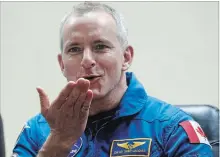  ?? DMITRI LOVETSKY
THE ASSOCIATED PRESS ?? Astronaut David Saint-Jacques blows a kiss through safety glass during a news conference Sunday in Kazakhstan.