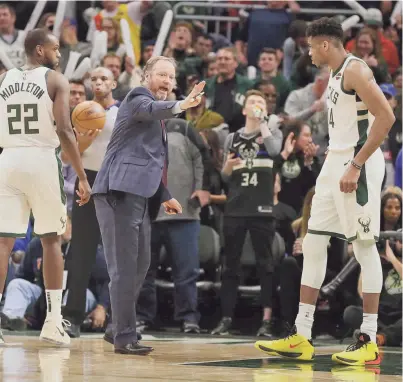  ?? JEFFREY PHELPS, ASSOCIATED PRESS ?? Coach Mike Budenholze­r and Giannnis Antetokoun­mp were back at work Wednesday as the Bucks resumed their quest of winning the NBA title.