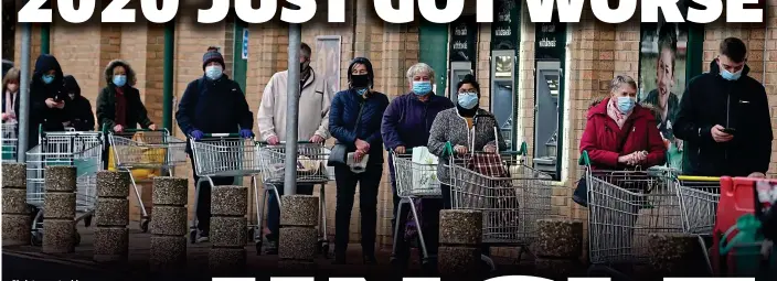  ?? PA ?? Christmas stocking: People wait in line to shop at Morrisons in Whitley Bay, Tyne and Wear, yesterday