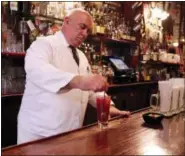  ?? MICHELLE LOCKE VIA AP ?? In this photo, a bartender at Harry’s New York Bar in Paris mixes up a bloody Mary. The cocktail is said to have been created at the bar, an institutio­n since 1911.