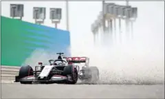  ?? POOL/AFP ?? Haas F1’s French driver Romain Grosjean spins out of track during the first practice session ahead of the Bahrain Formula One Grand Prix at the Bahrain Internatio­nal Circuit in the city of Sakhir on November 27.