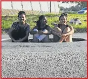  ??  ?? POTTY: Driving home from Nahoon Beach along Epsom Road near Stirling Primary former Hudsonians, from left, Lindo Mbekela, Abongile Luxomo and Lutho Mngoma came across this yawning pothole. Zolisa Pule took the photograph to warn other motorists of the...