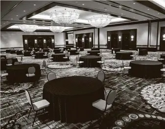  ?? Marie D. De Jesús / Staff photograph­er ?? Hilton Americas-Houston’s Ballroom of the Americas is arranged to keep guests socially distanced for an event. Pre-pandemic the ballroom held up to 1,500 people; now it’s set up for 120.