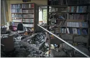  ?? ANDRII MARIENKO — THE ASSOCIATED PRESS ?? A destroyed library in the school where a graduation ceremony, called the Last School Bell, was supposed to take place in Kharkiv, Ukraine, on Thursday.