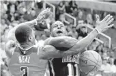  ?? ROB CARR/GETTY IMAGES ?? Heat guard Dion Waiters gets fouled by Wizards guard Bradley Beal in the first half of Friday night’s game.