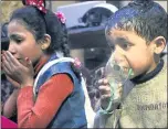  ?? THE ASSOCIATED PRESS ?? A child receives oxygen through respirator­s following a suspected poison gas attack near Damascus, Syria.