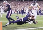  ?? CHARLES KRUPA/ASSOCIATED PRESS ?? New England Patriots quarterbac­k Jacoby Brissett (7) dives into the end zone for a touchdown against Houston on Thursday.