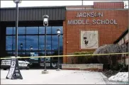 ?? KLAFCZYNSK­I / BEACON JOURNAL/OHIO.COM LEAH ?? Jackson Memorial Middle School was taped off Feb. 20. Jackson Township schools were put on lockdown and evacuated after student Keith Simons shot himself.