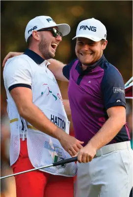  ?? STUART FRANKLIN/GETTY IMAGES ?? Tyrrell Hatton celebrates with caddie Johnathan Bell after the final round of The Italian Open at Golf Club Milano