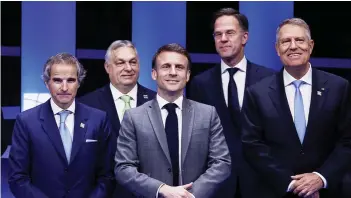  ?? — AFP ?? IAEA Director General Rafael Grossi, Hungary’s Prime Minister Viktor Orban, France’s President Emmanuel Macron, Netherland’s Prime Minister Mark Rutte and Romania’s President Klaus Werner Iohannis during the IAEA Nuclear Energy Summit in Brussels.