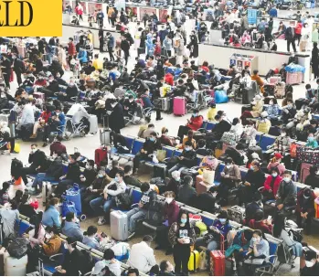  ?? STRINGER / REUTERS ?? Travellers fill Hankou Railway Station Wednesday after travel restrictio­ns to leave Wuhan, the capital of the central Hubei province and China’s epicentre of the novel coronaviru­s outbreak, were lifted.