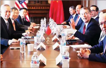  ?? CHIP SOMODEVILL­A/GETTY IMAGES/AFP ?? US Trade Representa­tive Robert Lighthizer (right) and Secretary of the Treasury Steven Mnuchin (second right) sit down with Chinese Vice Premier Liu He (left) and Central Bank Governor Yi Gang (second left) for negotiatio­ns in Washington on January 30.