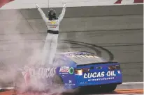  ?? JAE C. HONG/THE ASSOCIATED PRESS ?? Kyle Busch celebrates after winning the NASCAR Cup Series race Feb. 26 in Fontana, Calif. It was the final race at the famed track until NASCAR finishes its redesign into a short-track course.