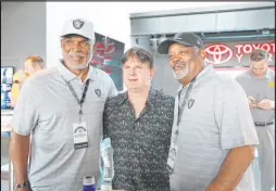  ?? Bizuayehu Tesfaye Las Vegas Review-journal ?? Former Raiders tight end Raymond Chester, left, and safety George Atkinson pose for a photo with Dave Sarro during the Raiders Foundation’s second annual Raiders Celebrity Swing at Topgolf in Las Vegas in 2019.