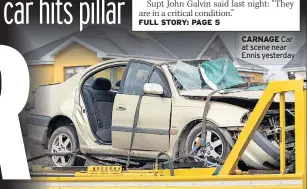  ??  ?? CARNAGE Car at scene near Ennis yesterday