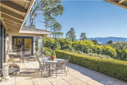  ?? Ron Bird Photograph­y ?? A sunny patio at 1675 Crespi Lane in Pebble Beach overlooks the serene landscape.