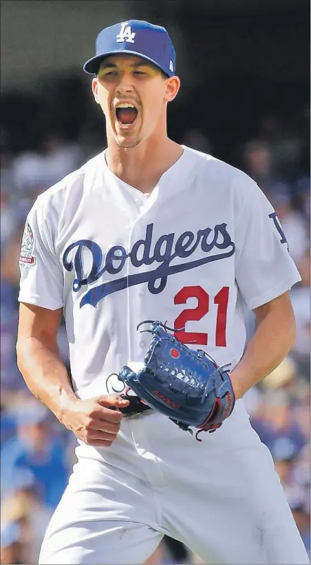  ?? Wally Skalij Los Angeles Times By Andy McCullough ?? WALKER BUEHLER closes out the sixth inning before departing with two outs in the seventh after holding the Colorado Rockies scoreless and to only one hit in a 5-2 victory that gives the Dodgers their sixth consecutiv­e National League West championsh­ip.