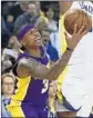  ?? Ben Margot Associated Press ?? ISAIAH THOMAS looks for a way around Warriors’ Kevon Looney.