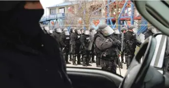  ?? PROVIDED ?? Officers from the Mobile Field Force who specialize in crowd control and are members of the Northern Illinois Police Alarm System take part in a training exercise.