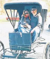  ?? CONTRIBUTE­D ?? Julianne McDonald and Jack Craft, co-owner of Finer Things Antiques and Curios in Halifax, N.S., are pictured in an antique carriage. They say homeowners often don’t realize the value of items they have tucked away.