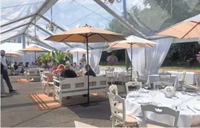  ?? REBECCA KING ?? Cream couches and chandelier­s bring elegance to Elia’s outdoor area.