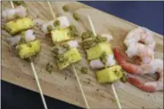  ?? MELISSA DAARABIAN VIA AP ?? Shrimp and pineapple skewers is a super easy go-to recipe, which uses pantry ingredient­s. You can even use canned pineapple to create something that still feels high-end.