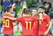  ??  ?? Spain’s Iago Aspas (second from R) celebrates after scoring a goal with teammates during an internatio­nal friendly against Tunisia.