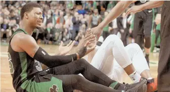  ?? HERALD PHOTO BY JIM MICHAUD ?? HURTING: Guard Marcus Smart is out indefinite­ly as he seeks a second opinion on the damage to his sprained right thumb.
