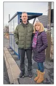  ??  ?? Brian and Karen Calder at bus stop in Port Seton