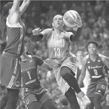  ?? Aaron Lavinsky Minneapoli­s Star Tribune ?? LINDSAY WHALEN scores 14 points and Minnesota hangs on despite blowing almost all of a 20-point lead.