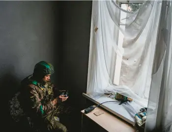  ?? DIMITAR DILKOFF/GETTY/AFP ?? A Ukrainian serviceman operates a drone Monday in Bakhmut. Several drones struck Russia.